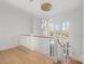 Bright foyer with a modern chandelier, staircase, and large windows providing natural light at 722 Hillside Ave, Charlotte, NC 28209