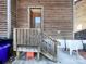 Outdoor view of entryway with stairs and wooden railings, plus yard at 813 Alexander St, Statesville, NC 28677