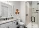 Modern bathroom with a glass-enclosed shower, granite countertop, and hexagon tile floor at 831 Naples Dr, Davidson, NC 28036