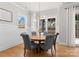 Bright dining area features stylish lighting, wood floors and backyard views, perfect for Gathering gatherings at 831 Naples Dr, Davidson, NC 28036