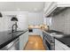 Modern kitchen featuring stainless steel appliances, and a large countertop with hardwood floors at 831 Naples Dr, Davidson, NC 28036