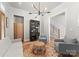 Cozy living room featuring hardwood floors, neutral paint, modern lighting, and elegant furnishings at 831 Naples Dr, Davidson, NC 28036