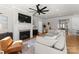 Elegant living room with a cozy fireplace, stylish seating, and tasteful decor, perfect for comfort at 831 Naples Dr, Davidson, NC 28036