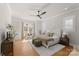 Bright main bedroom with a work space, plush rug, and fan, creating a cozy retreat at 831 Naples Dr, Davidson, NC 28036