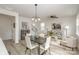 Stylish dining room with modern lighting, hardwood floors, and open layout at 927 Cathey Rd, Charlotte, NC 28214