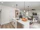 Bright kitchen features quartz countertops, stainless appliances, and pendant lighting above the island at 927 Cathey Rd, Charlotte, NC 28214