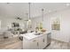Open concept kitchen with stainless steel appliances, white cabinetry, and island at 927 Cathey Rd, Charlotte, NC 28214