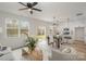 Open-concept living room featuring hardwood floors, bright windows, and modern furniture at 927 Cathey Rd, Charlotte, NC 28214
