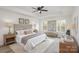 Spacious main bedroom with tray ceiling and large windows offering an abundance of natural light at 927 Cathey Rd, Charlotte, NC 28214