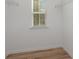 Walk-in closet featuring a window and shelving, offering functional storage at 927 Cathey Rd, Charlotte, NC 28214