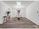 Bright and airy dining room with modern chandelier, round table, and sleek wood floors at 1050 Sheraton Way, Rock Hill, SC 29732