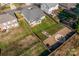 Aerial view of a home with a large, fenced backyard, a patio, and a firepit area at 1137 Mckee Farm Ln, Belmont, NC 28012