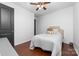 Cozy bedroom with hardwood floors, ceiling fan, and a comfortable bed at 1137 Mckee Farm Ln, Belmont, NC 28012