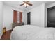 This is a bright bedroom with hardwood floors, a ceiling fan, and neutral walls at 1137 Mckee Farm Ln, Belmont, NC 28012