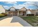 Traditional two-story home with a driveway leading to an attached two-car garage at 1137 Mckee Farm Ln, Belmont, NC 28012