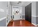 Bright foyer with hardwood floors, white trim, black closet doors, and ample natural light at 1137 Mckee Farm Ln, Belmont, NC 28012
