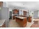 Spacious kitchen features granite countertops, stainless steel appliances, and center island at 1137 Mckee Farm Ln, Belmont, NC 28012