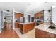Updated kitchen with stainless steel appliances, an island, and granite countertops at 1137 Mckee Farm Ln, Belmont, NC 28012