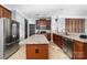 Well-lit kitchen featuring stainless steel appliances, granite countertops, and an island at 1137 Mckee Farm Ln, Belmont, NC 28012
