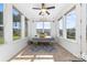 Sunroom with bench seating, white shiplap walls, and lots of windows at 1137 Mckee Farm Ln, Belmont, NC 28012