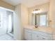 Bright bathroom features a vanity with white cabinets and a shower at 1295 Reservation Rd, Rock Hill, SC 29730