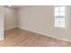 Simple bedroom with hardwood floors and large window at 1295 Reservation Rd, Rock Hill, SC 29730