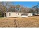 Side view of ranch home, screened porch and detached garage at 1295 Reservation Rd, Rock Hill, SC 29730