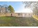 Tan mobile home with a large backyard and mature trees at 1295 Reservation Rd, Rock Hill, SC 29730