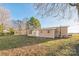 Tan mobile home with backyard and patio at 1295 Reservation Rd, Rock Hill, SC 29730