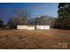 Tan mobile home with screened porch and attached garage at 1295 Reservation Rd, Rock Hill, SC 29730