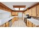 Kitchen with light wood cabinets, laminate floors and island at 1295 Reservation Rd, Rock Hill, SC 29730