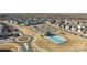 Community aerial view featuring a swimming pool, ample parking, playground, and roundabout at 1503 Ainslie Place Rd, Indian Trail, NC 28079