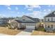 Beautifully landscaped property featuring a well-maintained lawn and an attached two-car garage at 1503 Ainslie Place Rd, Indian Trail, NC 28079