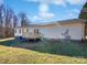 Home exterior showcasing a deck and spacious backyard at 153 Pattys Pl, Stony Point, NC 28678