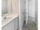 Bathroom with white vanity, and access to bedroom hallway at 153 Pattys Pl, Stony Point, NC 28678