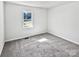 Spacious bedroom with grey carpet and large window at 153 Pattys Pl, Stony Point, NC 28678