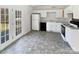 White kitchen with new appliances and access to backyard deck at 153 Pattys Pl, Stony Point, NC 28678