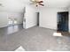 Open concept living room with access to the kitchen and backyard at 153 Pattys Pl, Stony Point, NC 28678