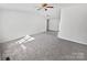Bright living room with grey carpeting and natural light at 153 Pattys Pl, Stony Point, NC 28678