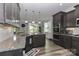 Modern kitchen with stainless steel appliances, granite countertops, and view into the dining area at 159 W Warfield Dr, Mooresville, NC 28115