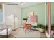 Bright home office with a desk, chair, and leafy plants at 1616 Shoals Ave # 152, Belmont, NC 28012