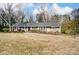 Ranch home with gray roof, landscaping, and a curved driveway at 170 Sherwood Cir, Rock Hill, SC 29730
