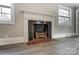 Traditional fireplace with dark tile and brass andirons at 170 Sherwood Cir, Rock Hill, SC 29730