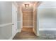Bright hallway with neutral walls, wood floors and white doors at 170 Sherwood Cir, Rock Hill, SC 29730
