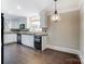 Modern kitchen with white cabinets, black appliances, and granite countertops at 170 Sherwood Cir, Rock Hill, SC 29730