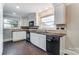 Modern kitchen with white cabinets, black appliances and granite countertops at 170 Sherwood Cir, Rock Hill, SC 29730