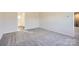 Carpeted bedroom with access to a bathroom and loft area at 1713 Wooten Way, Bessemer City, NC 28016