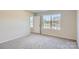 Spacious bedroom with gray carpet and large windows at 1713 Wooten Way, Bessemer City, NC 28016