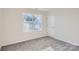 Well-lit bedroom with gray carpet and double window at 1713 Wooten Way, Bessemer City, NC 28016