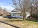 White house with mature trees and a grassy yard at 1790 17Th Ne Ave, Hickory, NC 28601